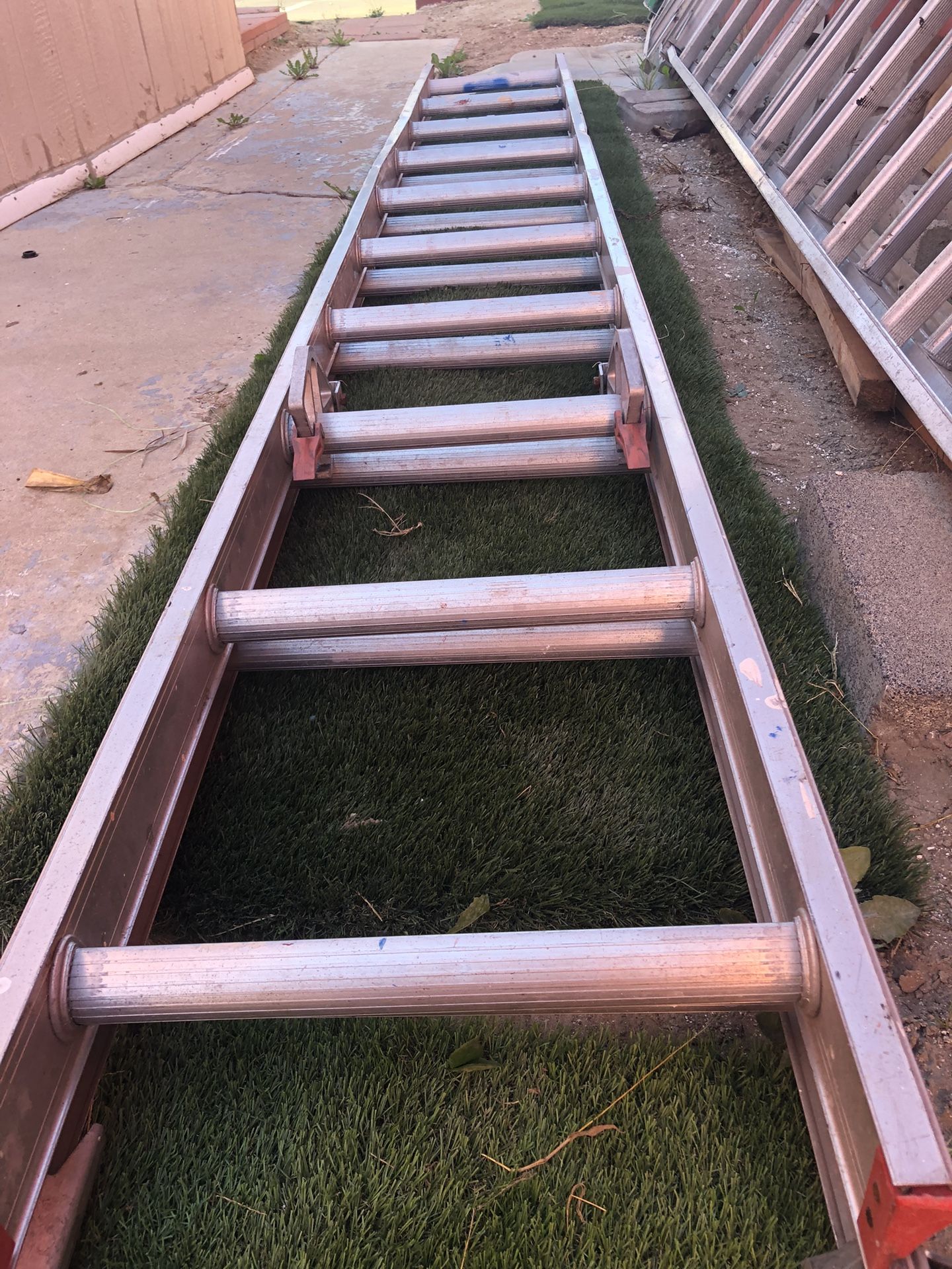 The image shows a Werner 16ft. Fiberglass Extension Ladder.