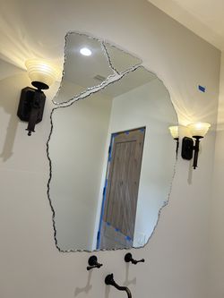 Large mirror cut into three parts