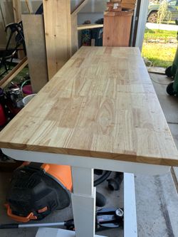 Husky adjustable height work bench with tool storage drawers