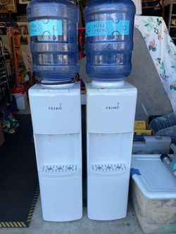 Two Primo Water Dispensers with Bottle