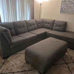 Gray Living Spaces Sectional w/ Storage Ottoman