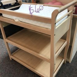 Sturdy changing table with pad