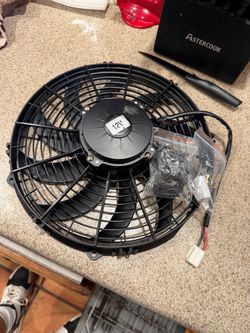 12 inch universal pulling fan. NEW