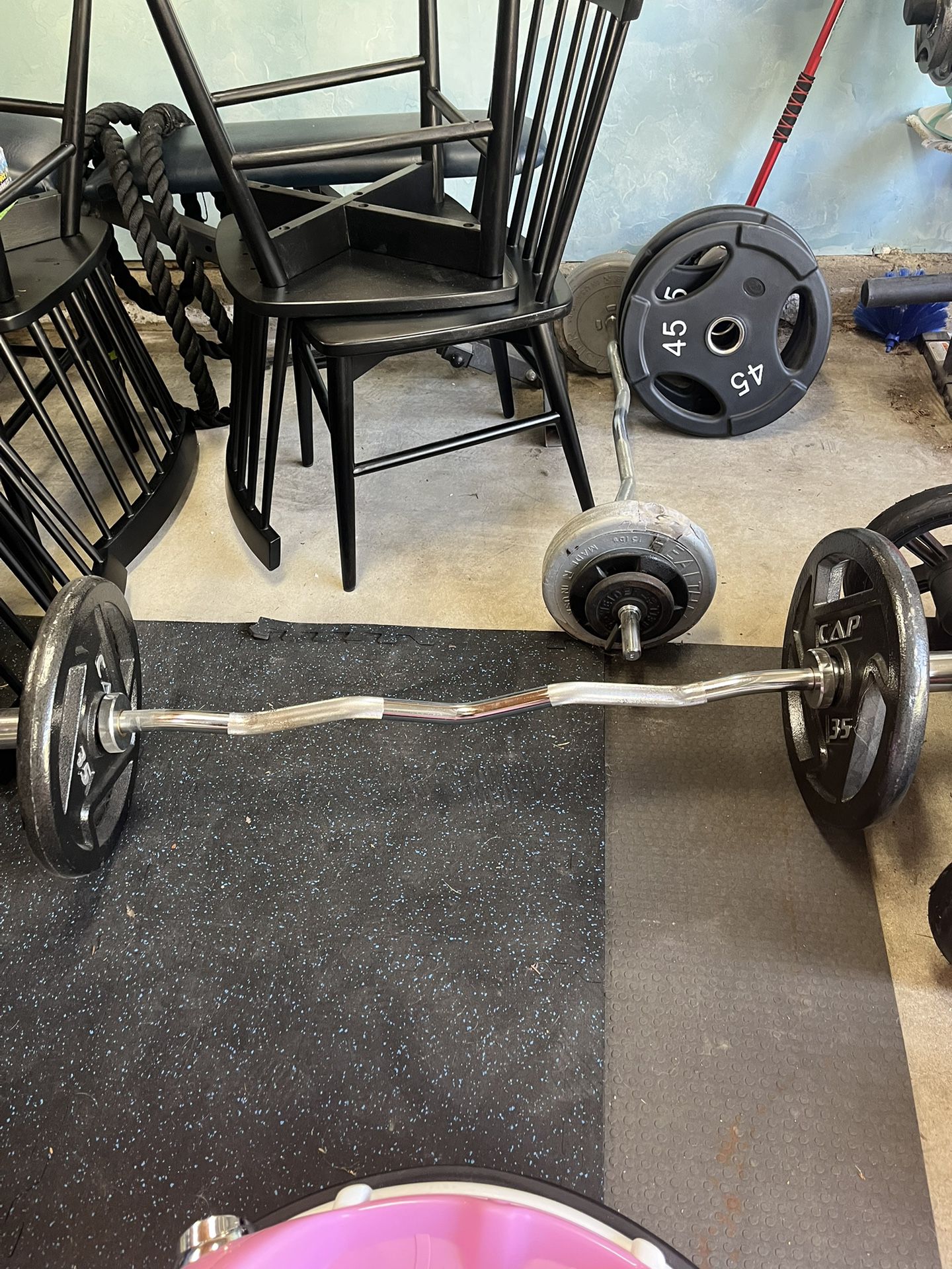 Olympic curl bar with 35’s on each side 