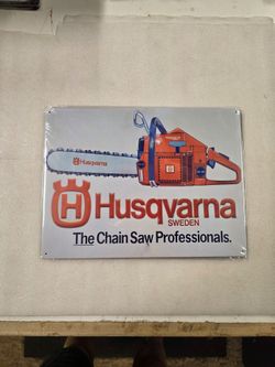 Husqvarna chainsaw ad faux vintage metal sign