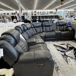 Black Sectional With Power Recliner, And Speakers And With Wireless Charger