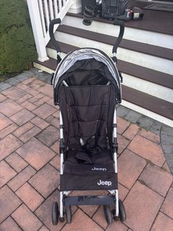 Black Jeep Umbrella Stoller with handlebar storage bag
