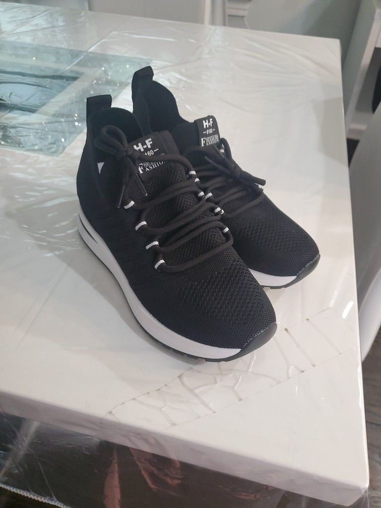 Woman's Black And White Gym Shoes
