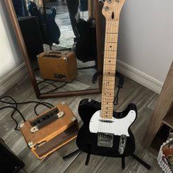 Black Electric Guitar and Amp