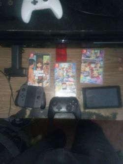 Nintendo switch with accessories and games