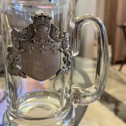 Beer Steins.  Very heavy.  Front of steins engraved with “Family Friendship Honor”.  Perfect condition.