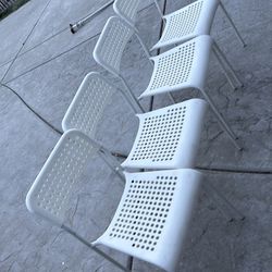 4 white chairs