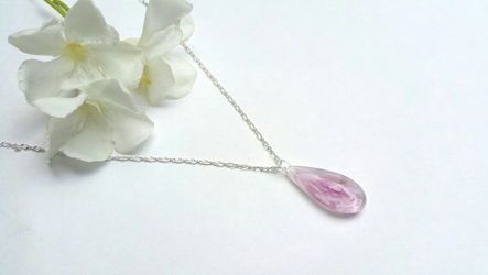 Necklace with handblown glass teardrop pendant with painted pink flower on a silver colored chain