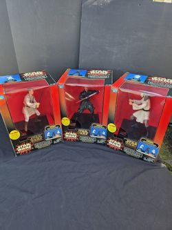 These are Star Wars Episode I Interactive Talking Banks from 1999, by Thinkway Toys - collectors LOVE  these Darth Maul

Obi-Wan Kenobi

Qui-Gon Jinn
