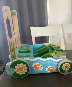 Wooden alligator baby walker