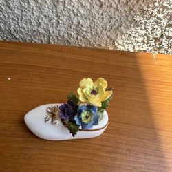 Masterpiece Bone China miniature shoe figurine, often adorned with flowers
