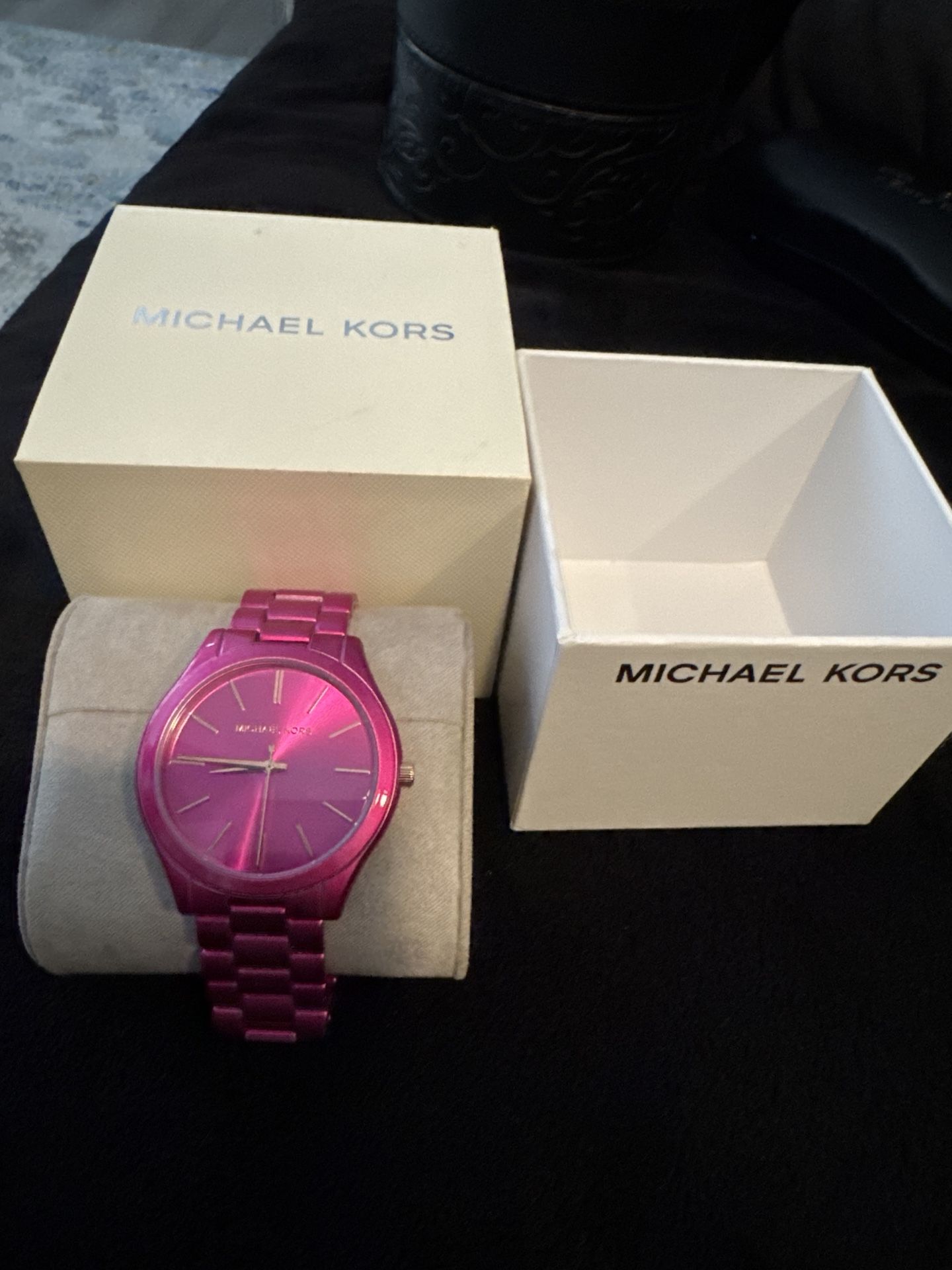Michael Kors watch with a bold metallic pink finish