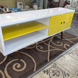 Mid-Century modern credenza/ TV stand banana, yellow and white measures 63 in Long 25 and 1/2 in high 15 in deep