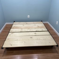 Queen size metal frame with optional extra wood sheets