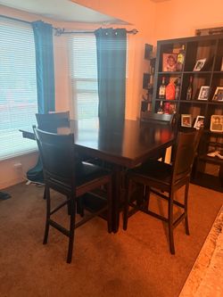 Counter height dining table with storage