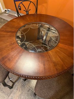 Ashley 4 chair with glass circle middle red wood dinette set