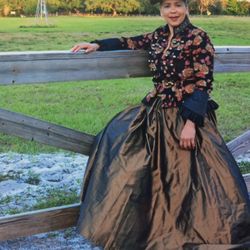 This is a Newport News black floral velvet military jacket With 100% Silk skirt Size 10