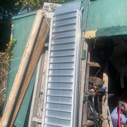Aluminum folding ramps made by Alcoa 7 foot long two ramps carry like a suitcase big money don’t need them anymore