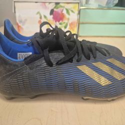 adidas X 19.3 Firm Ground in the Core Black, Gold Metallic, and Football Blue colorway. 