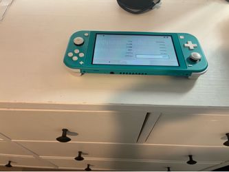 Nintendo Switch Lite + Charger – Great Condition