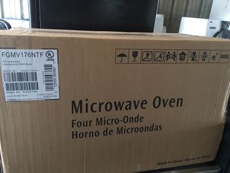 Brand new in the box over the range microwave oven