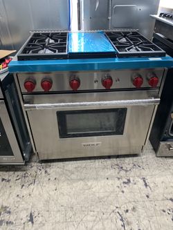 Wolf 36” slide in range with middle grill in stainless steel