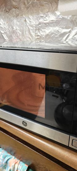 GE 1.1 cu. ft. countertop microwave with 950 watts of cooking power.