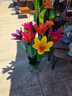 It is a decorative bouquet of metal tulip flowers.
