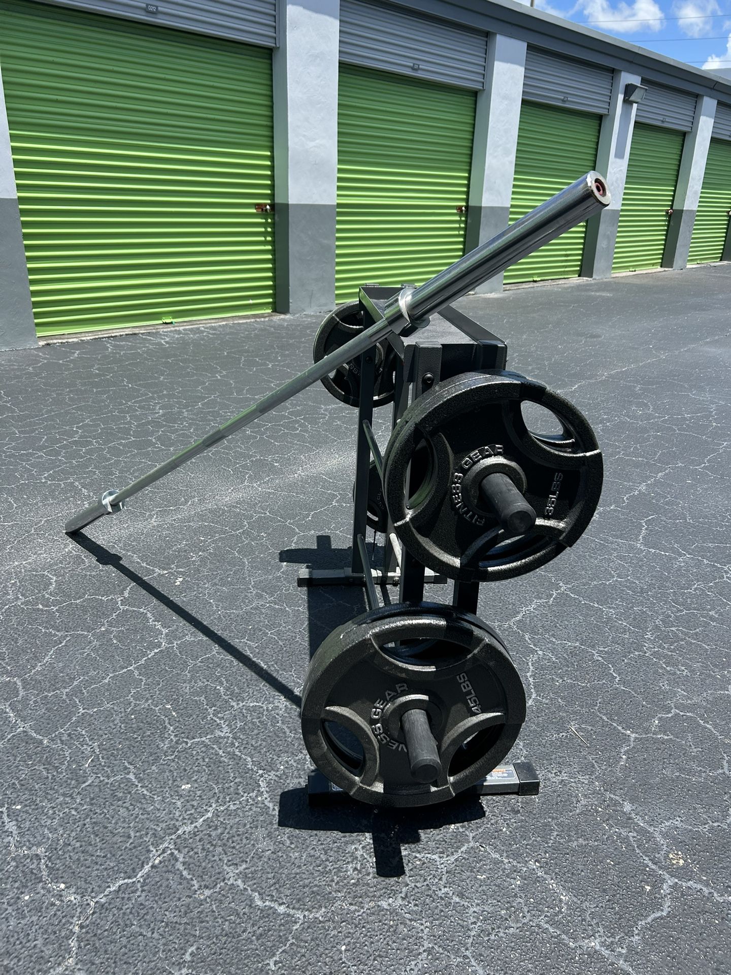 255lbs of Olympic weights plus barbell and dumbbell rack heavy duty Mint condition nice home gym