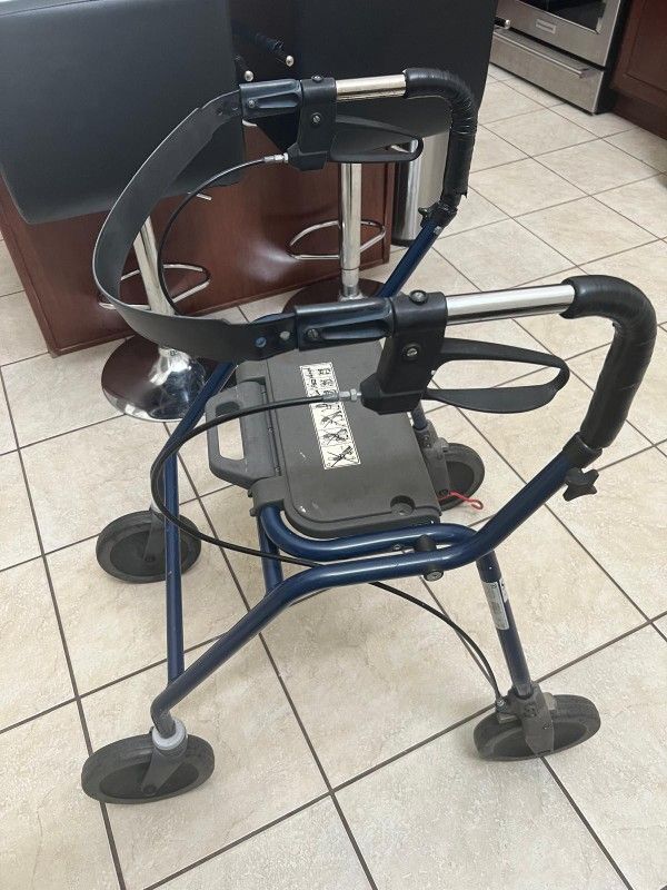 Four Wheeled Walker With Seat