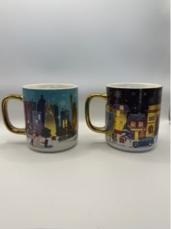 of 2 Anthropologie Holiday City Coffee Mugs / Tazas Navideñas Oro