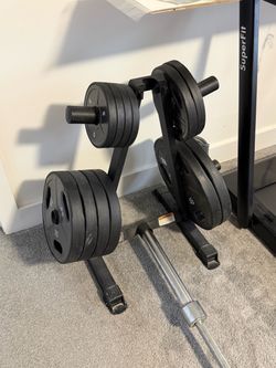 230 lbs. weight plates with barbell