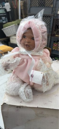 Porcelain Baby Doll in Pink Outfit