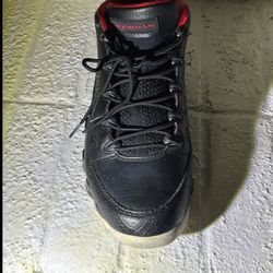Air Jordan 9 Retro Low in a black and university red colorway
