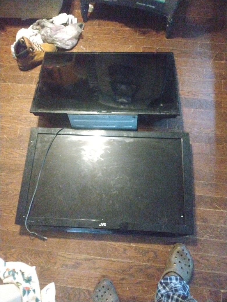 Two TVs Both Need Work One Needs The Power Buttons And The Buttons And The Other One Needs The Line It's Got Lines In It Both Of Them Has Lines In