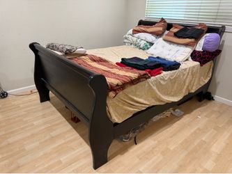 Solid queen size wood bed frame with box spring and mattress