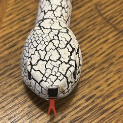 Amax Industrial Group: White and Black Reptile Toy