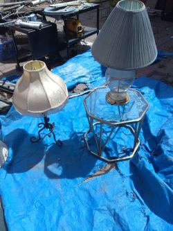 Two lamps and glass table