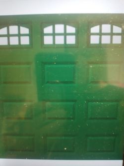 Used -7x7 garage/shed door w/windows