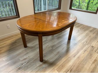 Solid wood table, very sturdy, w removable center leaf.