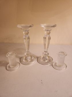 Four glass candle holders