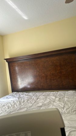 King sized wooden carved and designed bed frame and two nightstand chests set