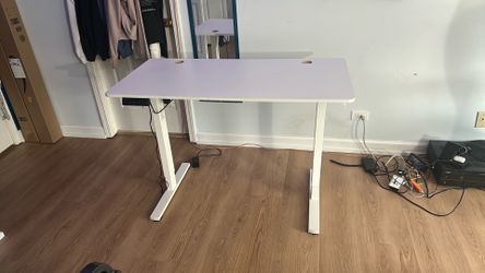 White electric standing desk with numeric display