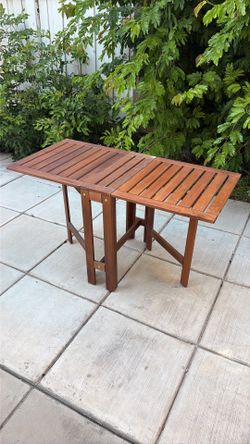 Two Garden Tables and Chairs