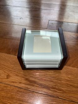 Swing set of photo coasters — square glass ones that slide into a dark wood